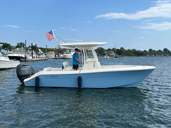 The motorboat is a Model 237CC; the boat's name is Sea-La-Vie.