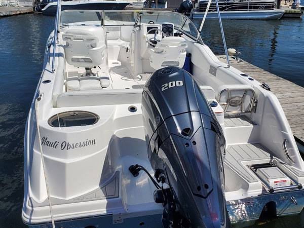 The motorboat is a Model 228-Traveler, and the boat's name is Nauti Obsession.