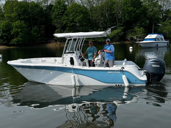 The motorboat is a Model 228-Commander, and the boat's name is Nice Bass.