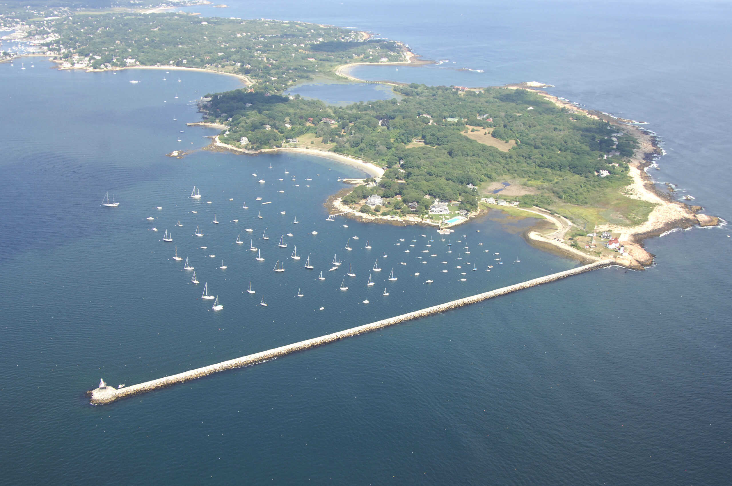 Photo of Gloucester Harbor shot from a plane giving a birds-eye-view of the notable fishing harbor.