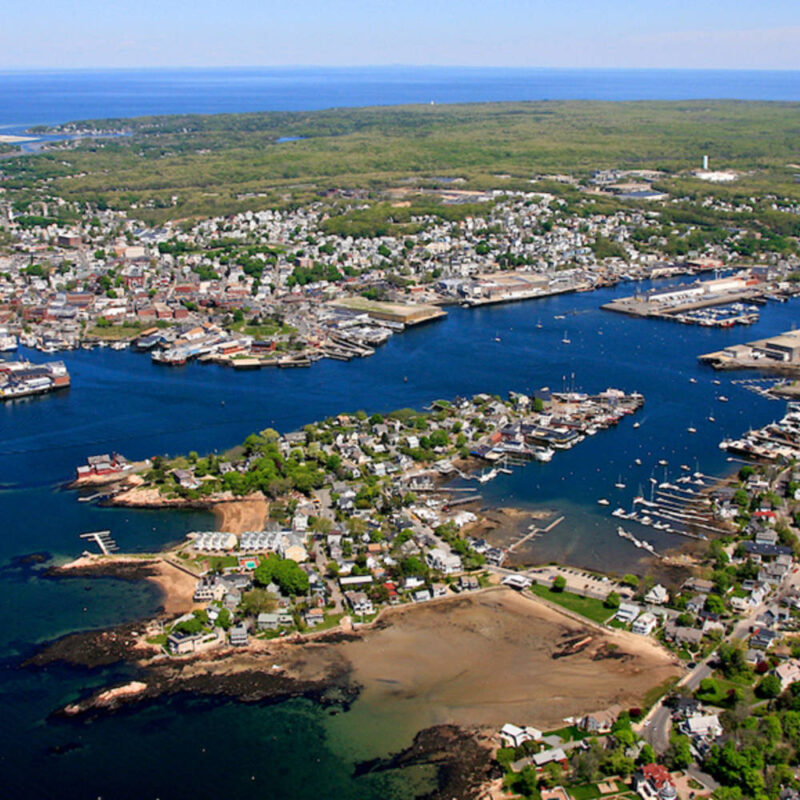 Photo of Gloucester Harbor shot from a plane giving a birds-eye-view of the notable fishing harbor.