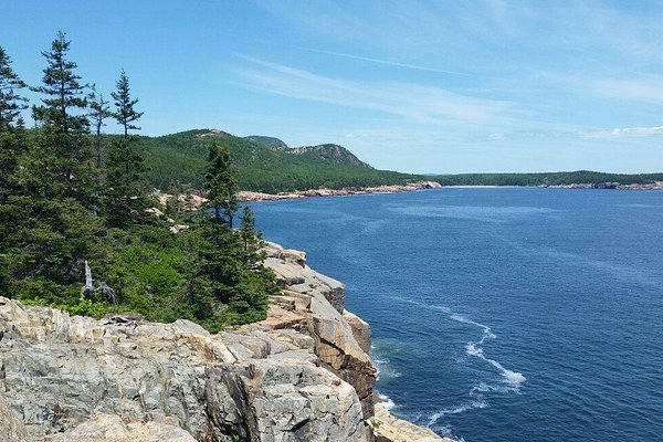 Bakers Island has a rocky coast and a beautiful view of the ocean.