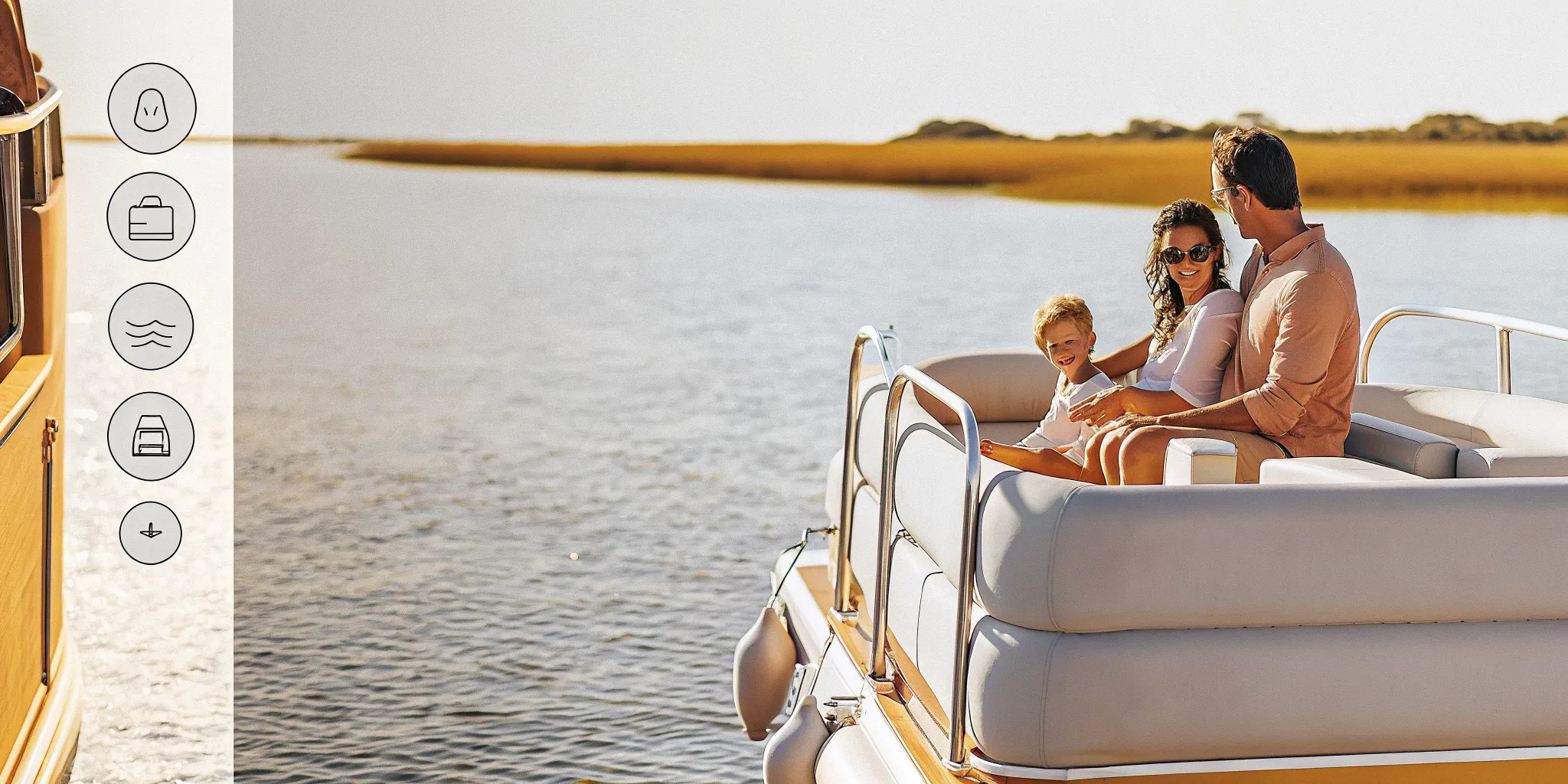 Family relaxing on a Carefree Boat Club boat cruising a calm New England harbor on a sunny day